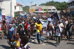 About 2,000 Papuans attend a protest march in Jayapura in July to urge the provincial parliament to demand a referendum on self-determination and to reject the region