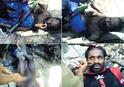 ‘‘Get a fire’’ ... video posted on YouTube shows two Papuan men 
being tortured by apparent members of the Indonesian security services. 
 One has a smouldering stick applied to his genitals.