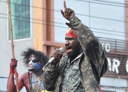 A Papuan protester addresses a crowd.